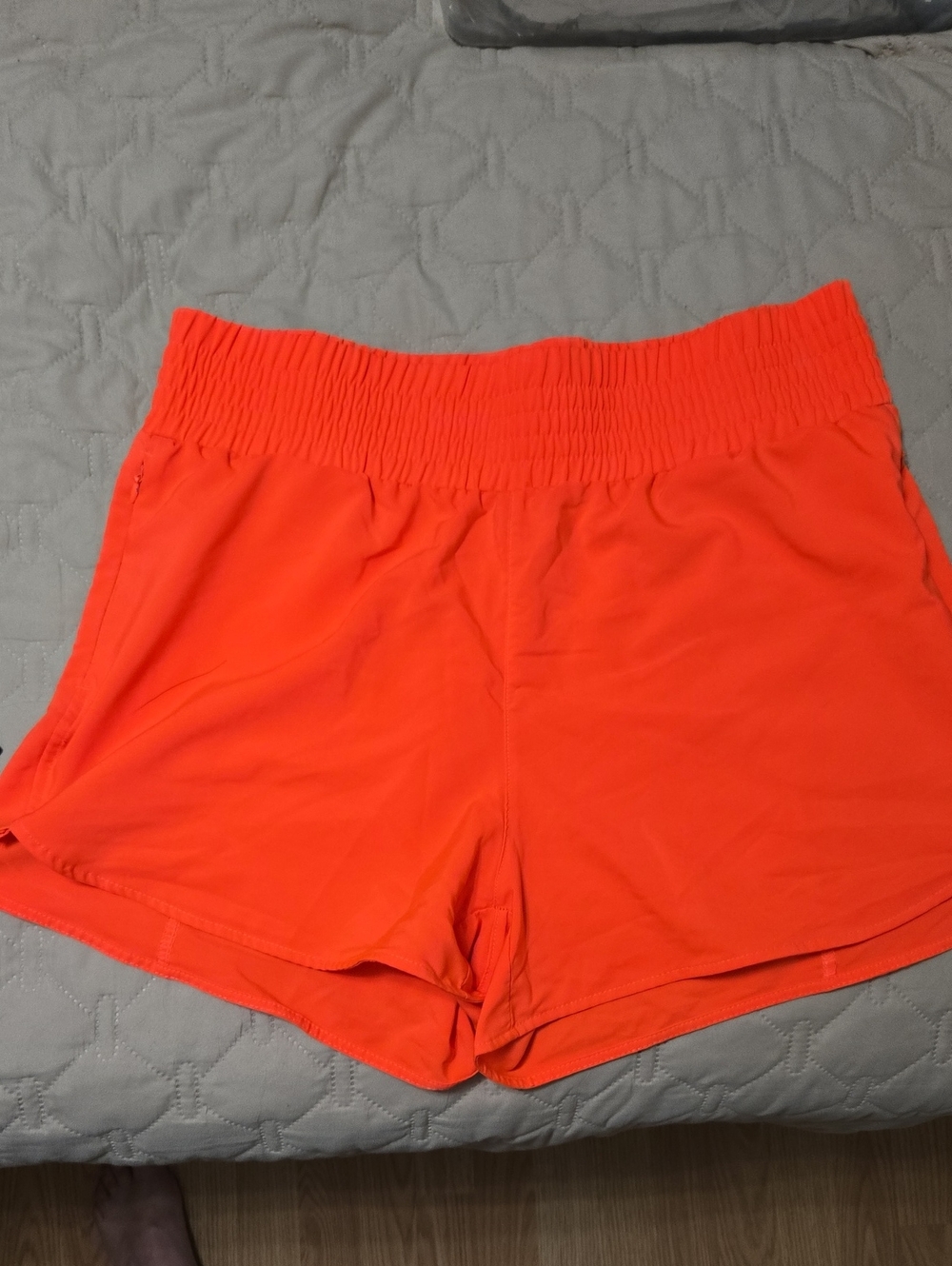 Women's Smocked Waist Athletic Shorts in Bright Orange